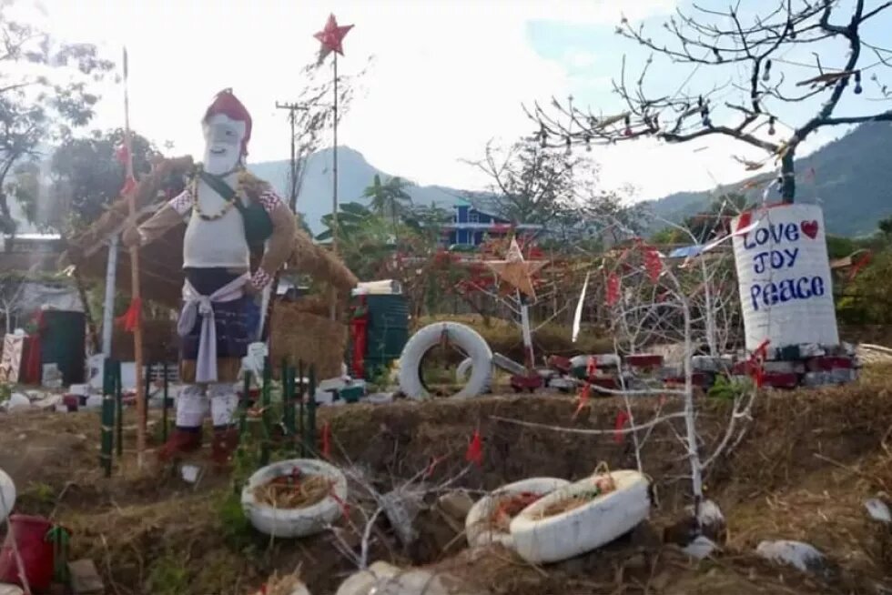 The complex co-existence of modernity-tradition in Northeast India. Frame one: ‘Santa Claus’/ 'Father Christmas’ with Naga spear and necklace. Photograph by the author at the outskirts of Kohima, Nagaland, December 2017