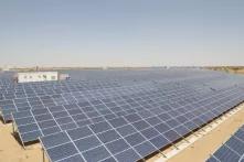 The deserts of Rajasthan have long been known for their spare beauty and their intense sunshine. Now that sun is being turned into a surge of solar power expansion that may one day power not just Rajasthan but a wide swath of India with clean energy. Photo by: Jitendra Parihar/Thomson Reuters Foundation 