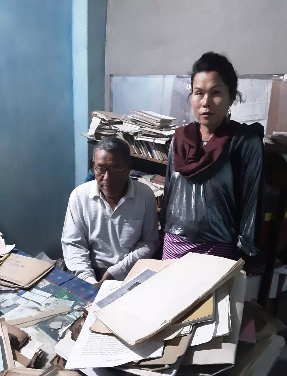 Santa Khurei in the library of a Puya (Meitei old scriptures) curator and translator of Meitei old script into modern Manipuri (Chanam Hemchandra, Naorenthong, Imphal West. Photo by: Bonita Pebam (Assist. Researcher, Pheida – Gender at the Periphery)