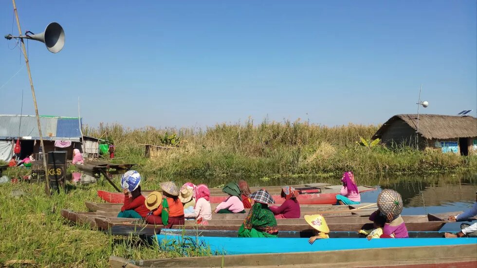 Canoes and Women in meeting