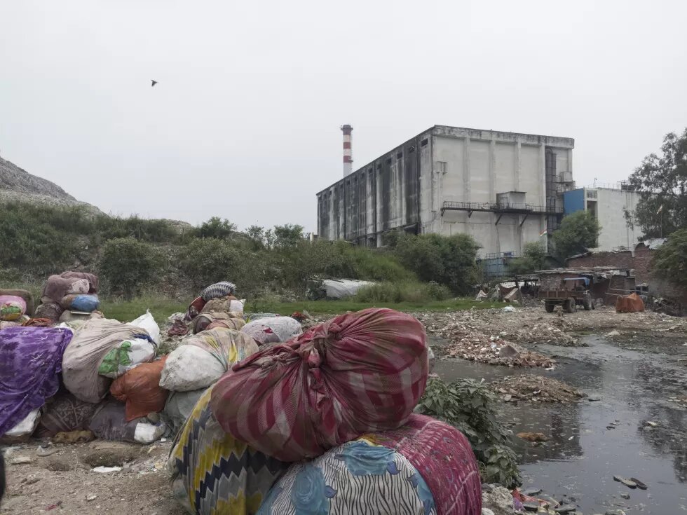 The waste to energy plant stands beside the Ghazipur landfill. 