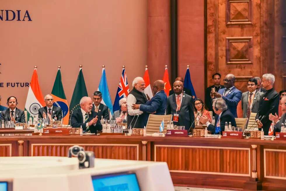 Indian Prime Minister Narendra Modi embracing the African Union Chairman and Comoros President Azali Assoumani, at the opening session of G20